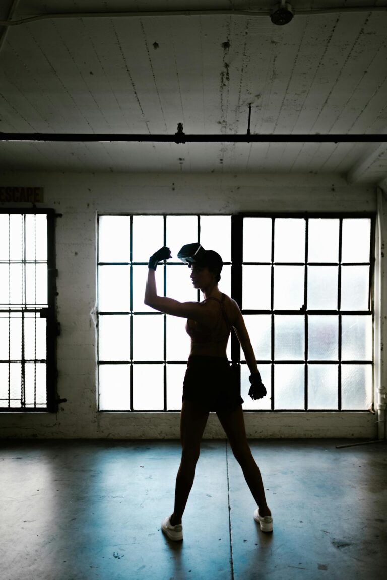 Backview of Fit Woman wearing Virtual Reality Glasses